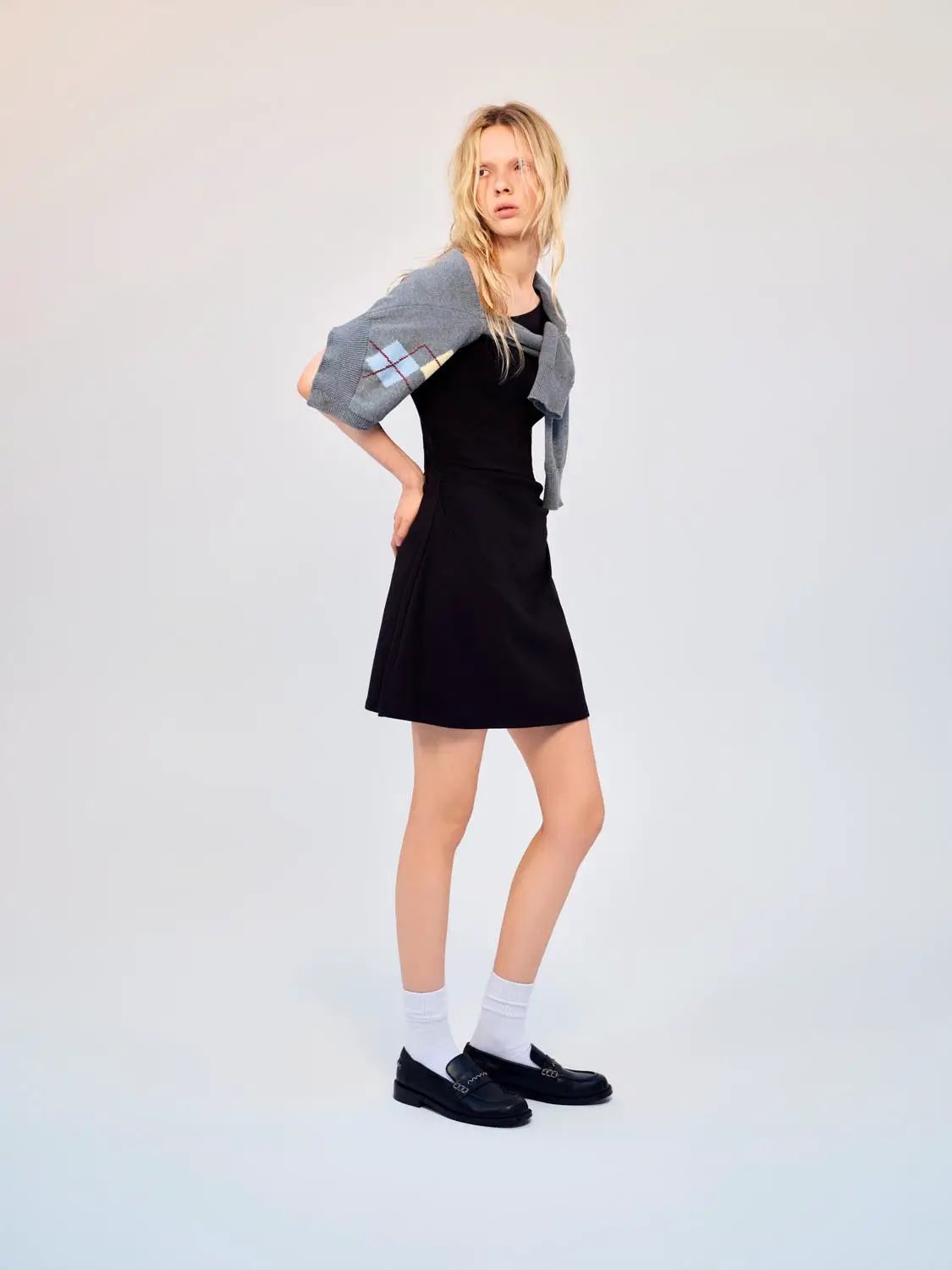 Cotton A-Line Dress in black, paired with a gray draped cardigan and black loafers