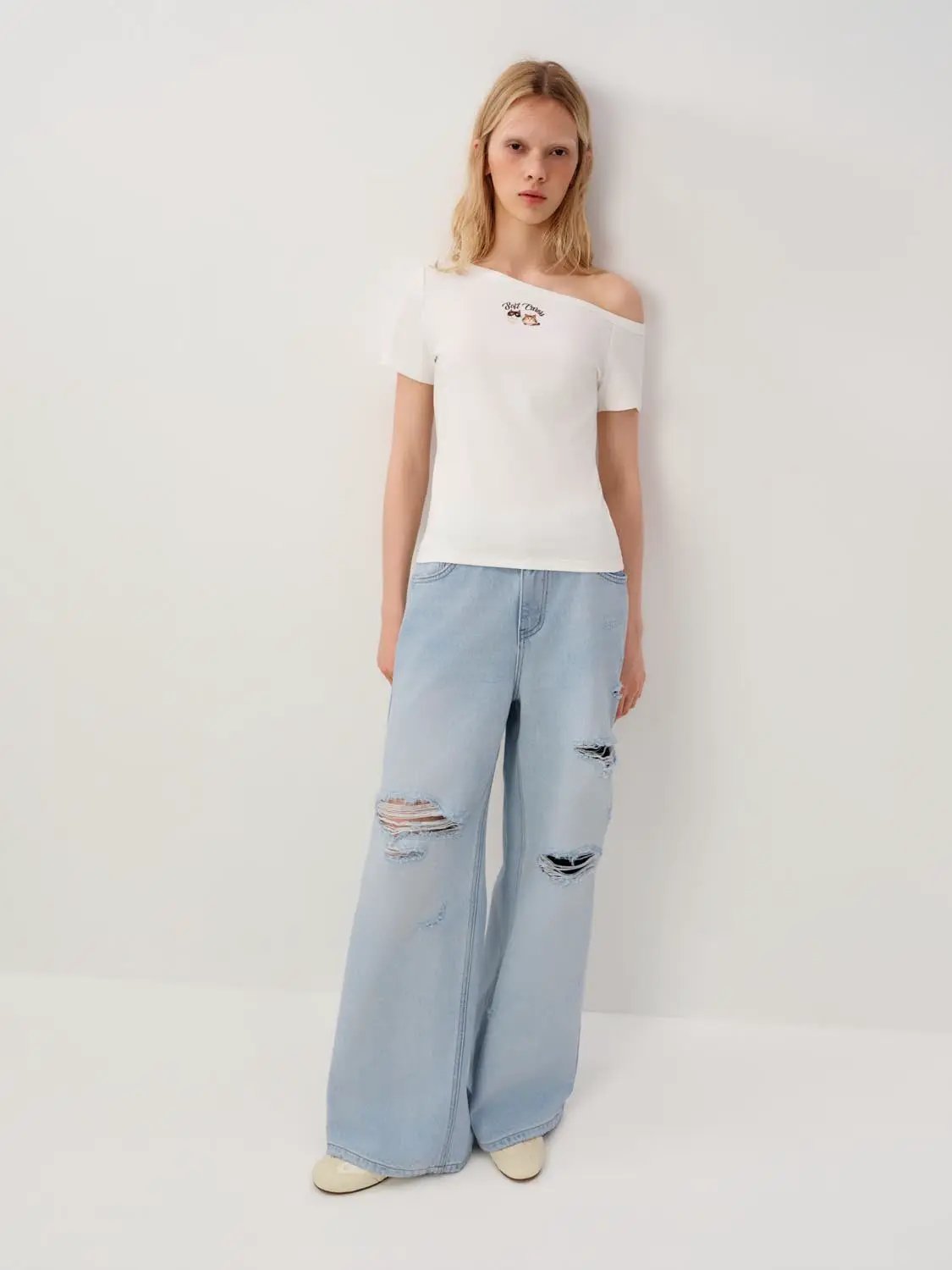 High Waisted Distressed Wide-leg Cotton Jeans, light blue denim with ripped knees.