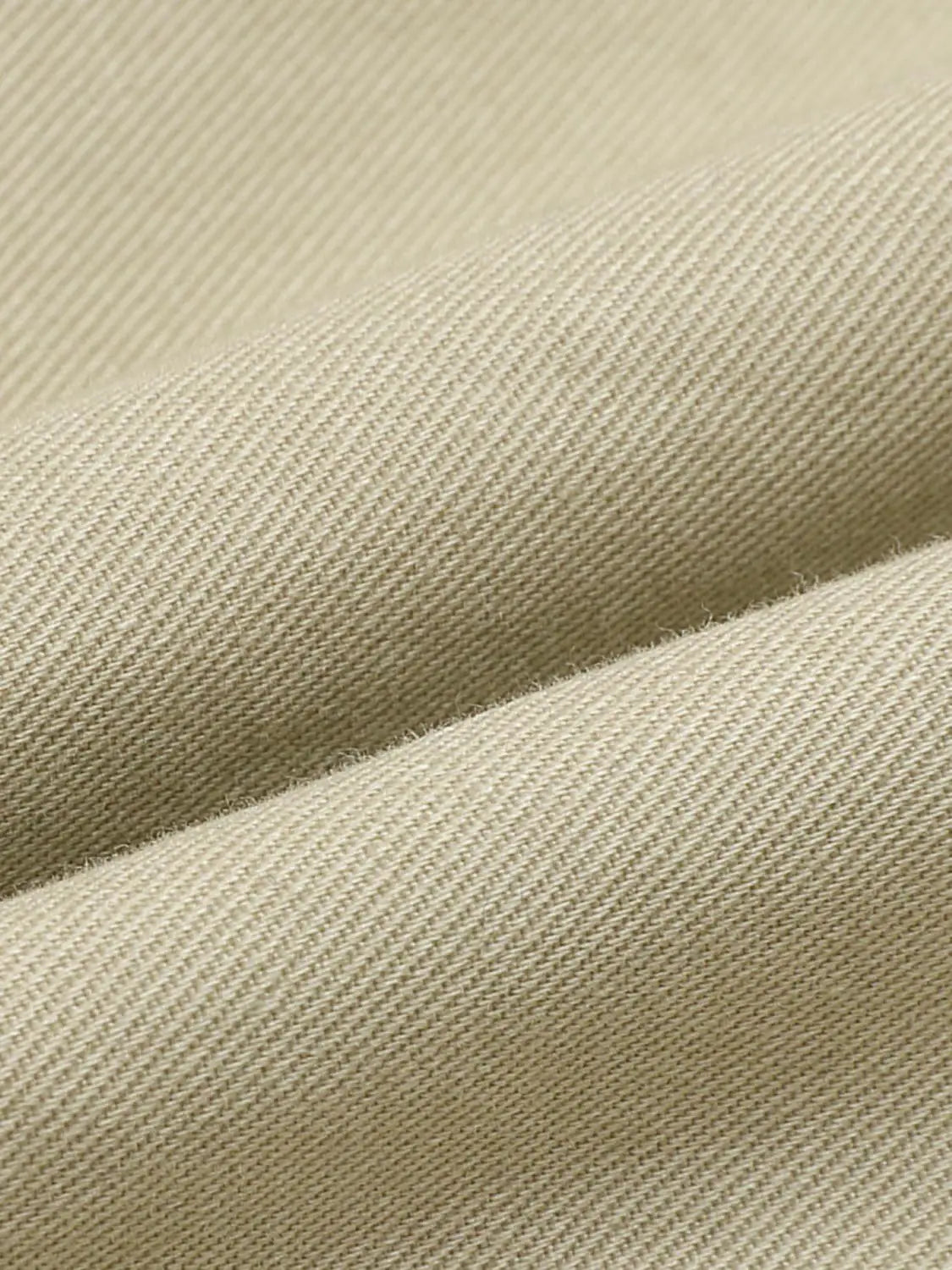 Casual jeans beige denim fabric close-up texture shows twill weave