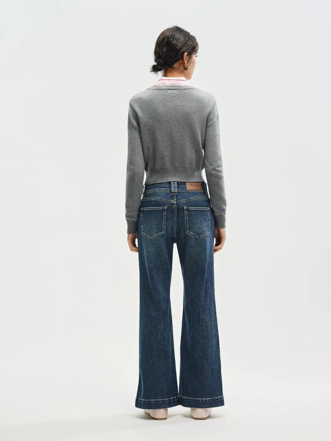 Jeans blue denim flare with back pockets and leather patch.