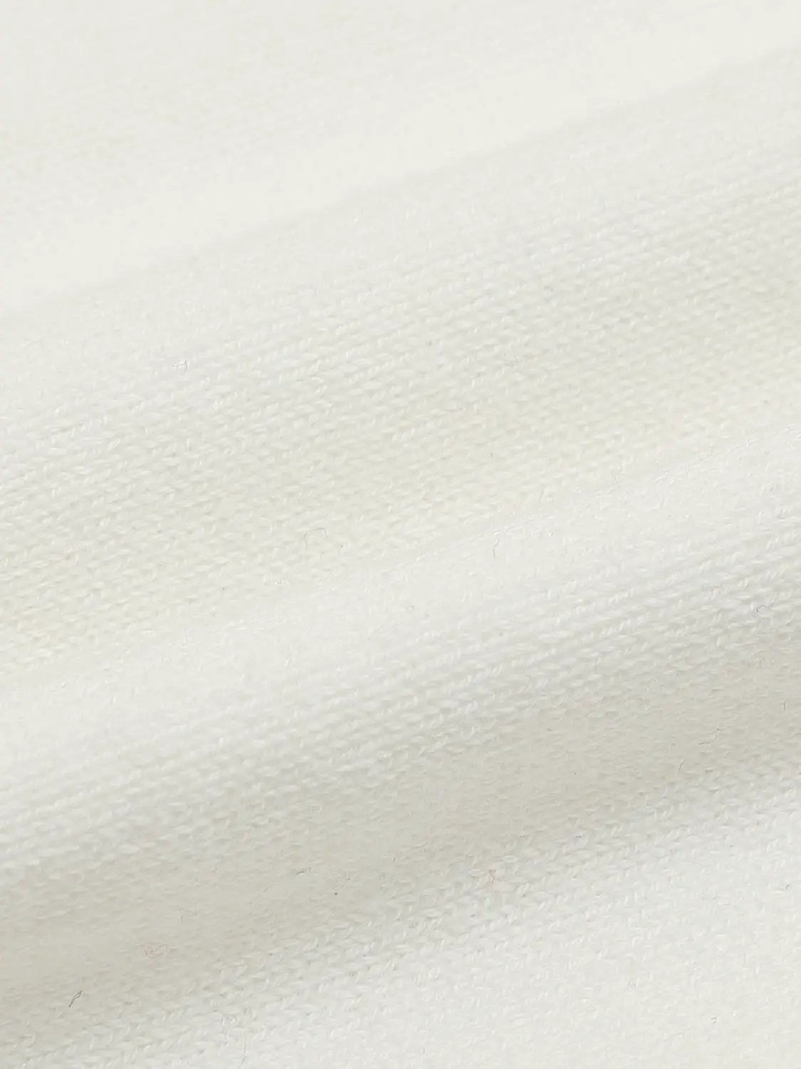 Crew neck knitted cardigan fabric close-up in white, soft texture