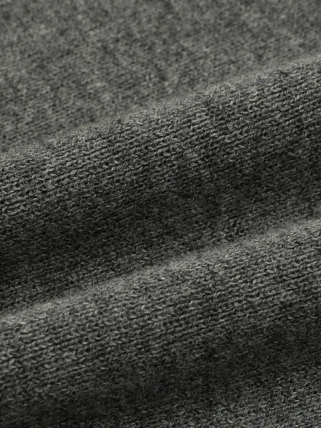 Knitted T-shirt fabric in charcoal gray with a textured weave