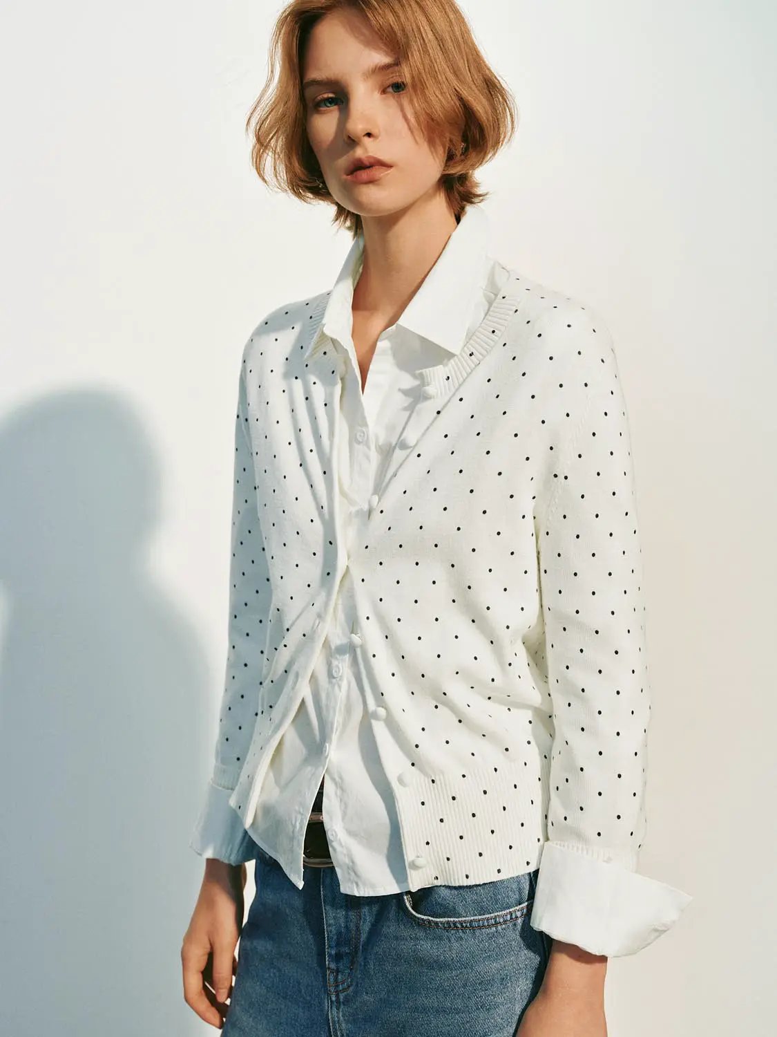 Knitted cardigan, white with black polka dots, button-front.