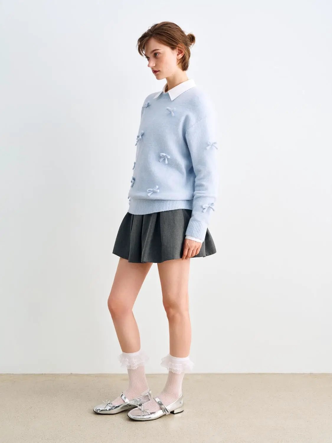 Knit T-Shirt by Urban Revivo Fashion, light blue with bow accents; grey pleated skirt shown