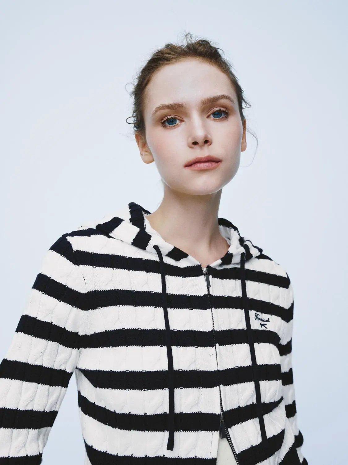 Knitted cardigan by Urban Revivo Fashion, black and white striped hoodie with front zipper.