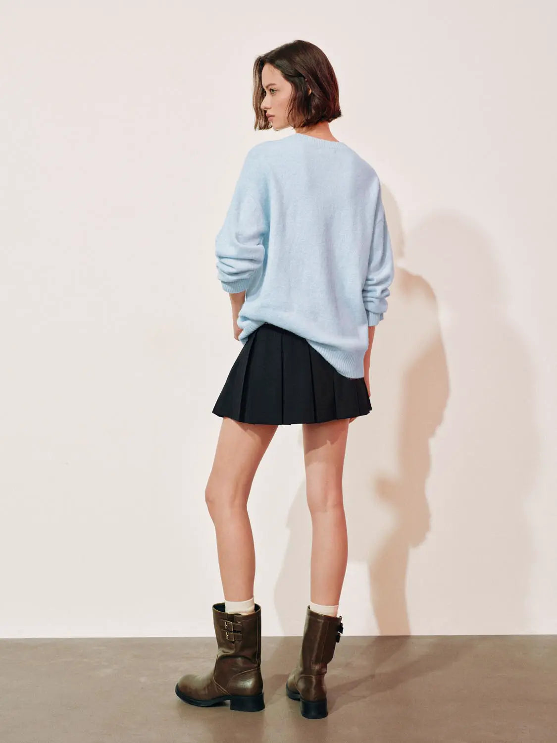 Knit T-Shirt oversized light-blue knit top by Urban Revivo Fashion, shown with black pleated mini skirt and brown boots