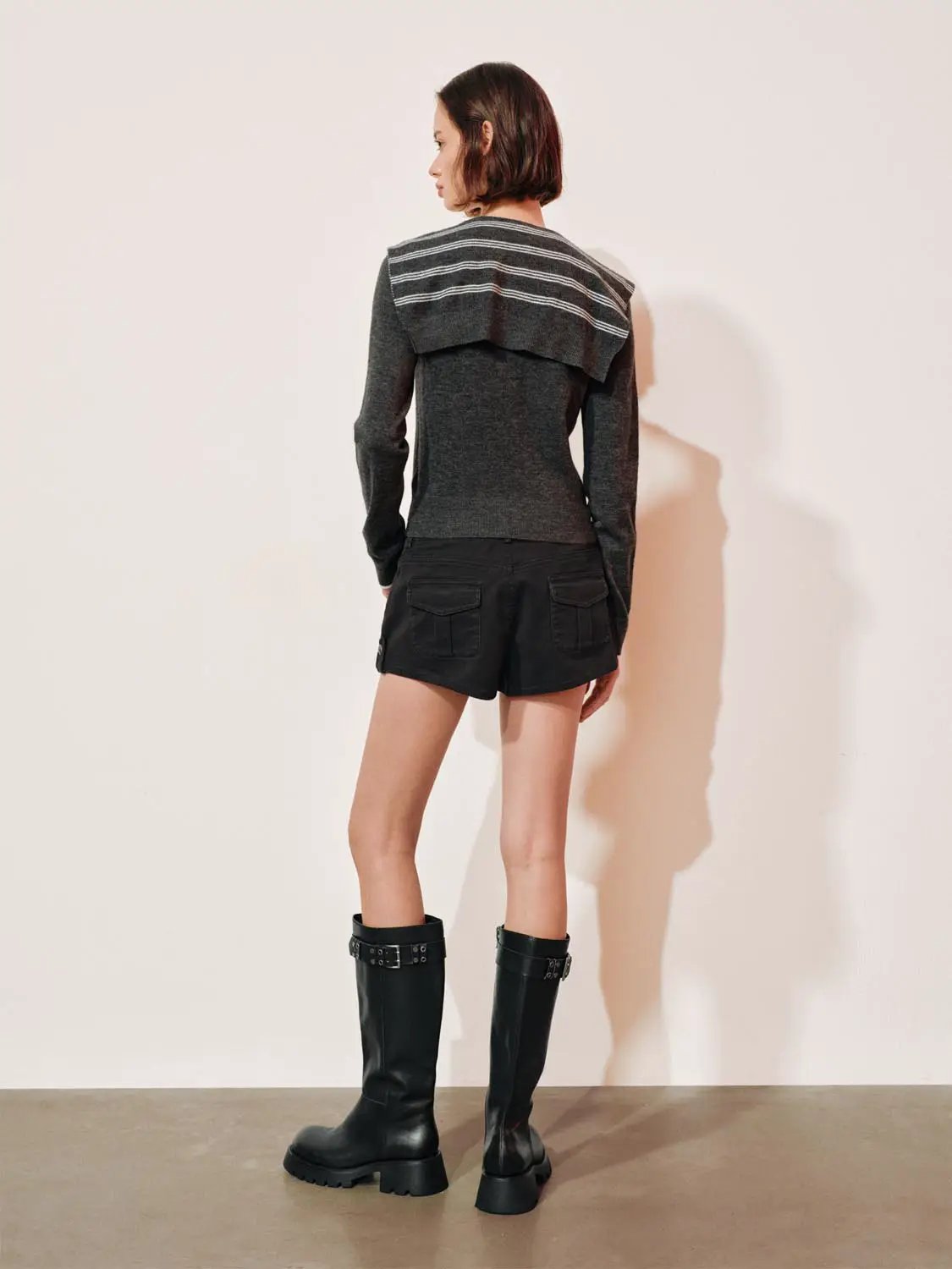 Knit striped shawl-collar cardigan with button front; dark heather gray with white stripe yoke